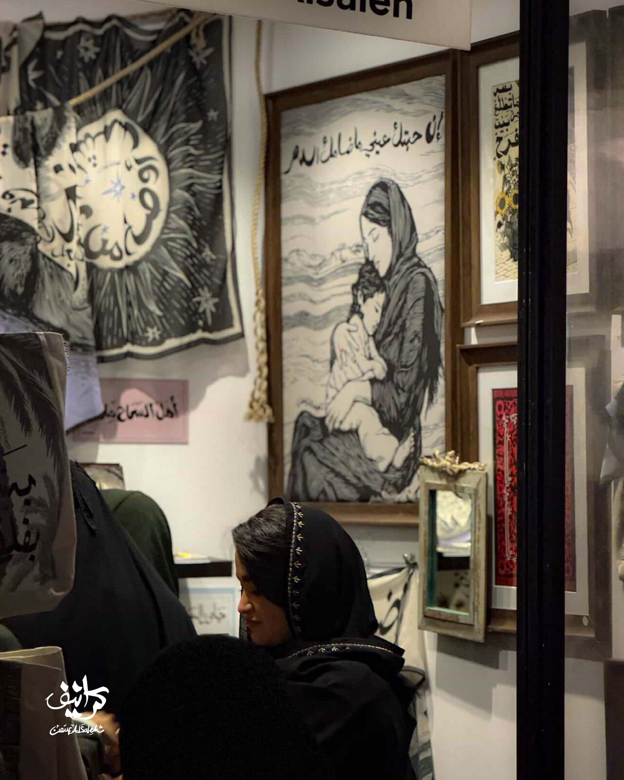 Inside the booth — artworks and visitors